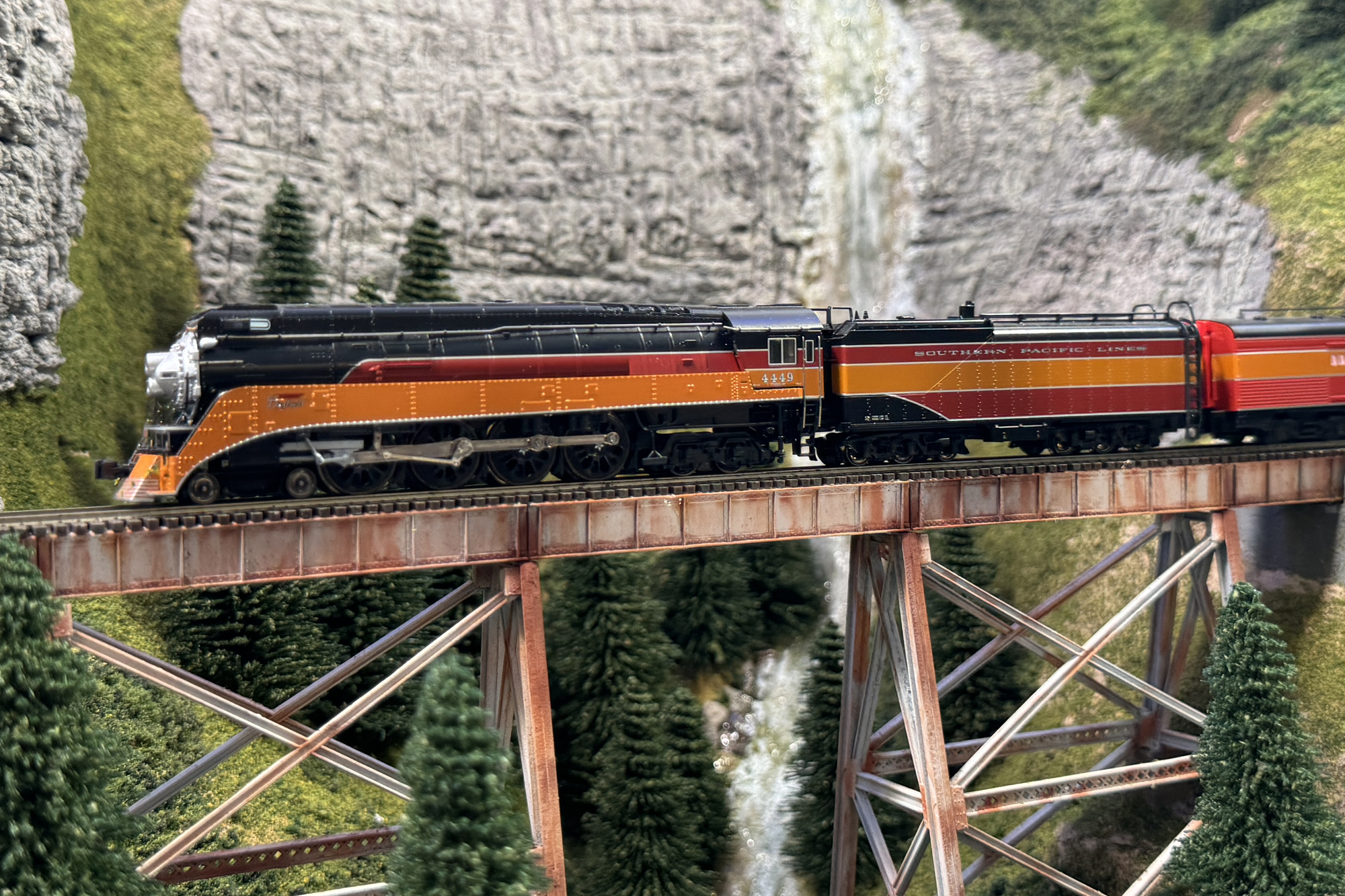 Southern Pacific Daylight passenger train taveling over a trestle.